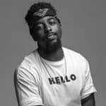 Eric Jackson in a white t-shirt that says Hello"