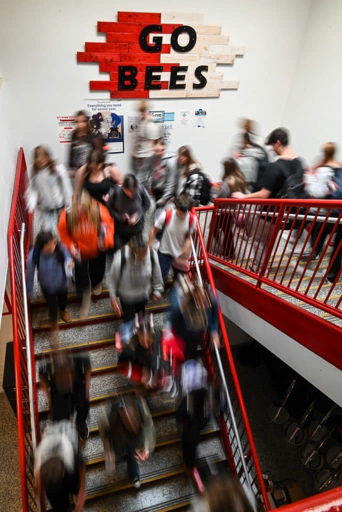 Students stream down the main staircase of Baldwinsville, New Yorks' Baker High School after the final bell.